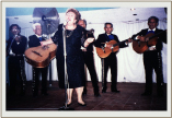 Tía Eva singing at the fiesta